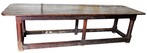 A late 17thC oak refectory table, with rounded plank top, six chamfered square legs and square framing, 80cm high, 85cm wide, 292cm long.