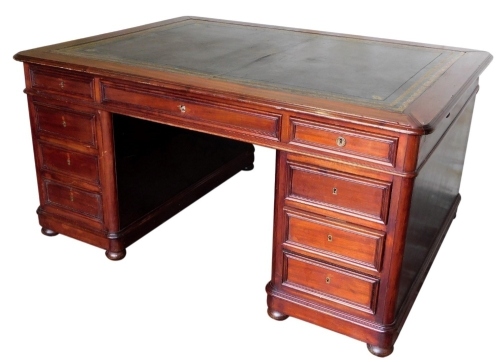 A Victorian mahogany partner's desk, with gilded leather skiver, frieze drawers, and two pedestals with drawers, 80cm high, the top 157cm x 116cm.