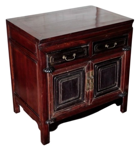 A Chinese cherrywood side cabinet, with two drawers over two doors, 82cm high, 82cm wide, 54cm deep.