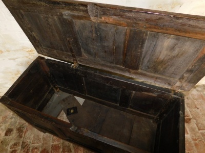 A 17thC oak coffer, with panelled top, arabesque carved lozenge and floret three panelled front, raised on stiles, 72cm high, 120cm wide, 49cm deep. - 2