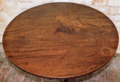 A George III mahogany supper table, with circular tilt tip, baluster turned pillar, and three out swept legs, 90cm diameter. - 2