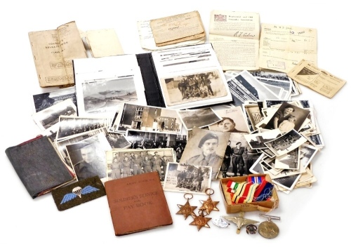 A group of Second World War medals and related items awarded to Pte. William Desmond Jessop, R.A.O.C., number 10547440, comprising 1939-45 Star, Africa Star, Italy Star and the 1939-45 War Medal, pin badges and cloth badge, Soldier's Service and Pay Book,