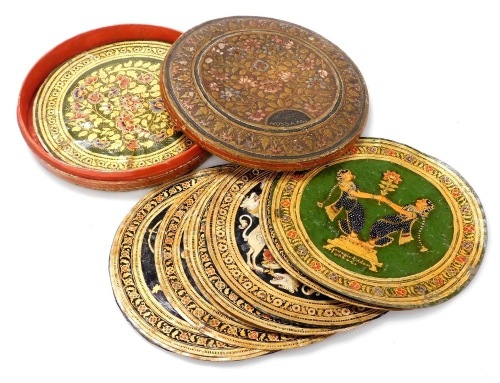 A set of sixteen 19thC Indian hand painted on hide roundels, possibly Ganjifa cards, in two suits, one set painted with figures, the other decorated with flowers, each 25.5cm diameter, contained in a floral decorated box marked Nossam 1883, with further c