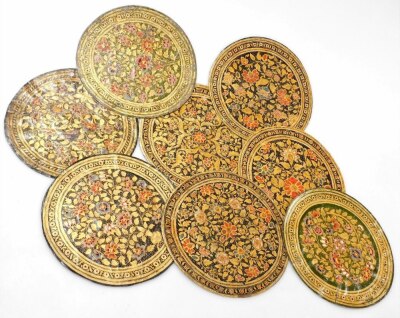 A set of sixteen 19thC Indian hand painted on hide roundels, possibly Ganjifa cards, in two suits, one set painted with figures, the other decorated with flowers, each 25.5cm diameter, contained in a floral decorated box marked Nossam 1883, with further c - 2