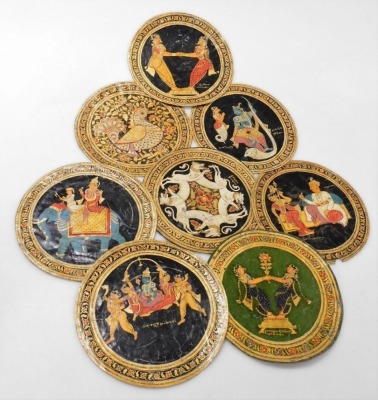 A set of sixteen 19thC Indian hand painted on hide roundels, possibly Ganjifa cards, in two suits, one set painted with figures, the other decorated with flowers, each 25.5cm diameter, contained in a floral decorated box marked Nossam 1883, with further c - 3