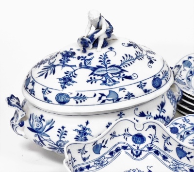 An early 20thC Meissen Onion pattern blue and white porcelain dinner and dessert service, comprising soup tureen and cover, with figural finial, pair of graduated meat platters, oval fish platter, integral sauce boat on stand, three square dishes, twenty- - 2