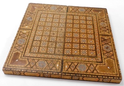 A Moorish inlaid backgammon box, profusely inlaid with finely detailed parquetry panelling and with mother of pearl, 7.5cm high, 9.5cm wide, 24.5cm deep. - 3