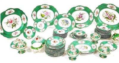 A mid 19thC dinner service by John Ridgway and Co, painted with sprays of mixed summer flowers in polychrome enamels, within green and gilt scroll borders, comprising two large oval meat plates, 55cm, two smaller oval meat plates, 49cm, tree oval serving