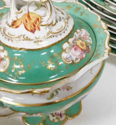 A mid 19thC dinner service by John Ridgway and Co, painted with sprays of mixed summer flowers in polychrome enamels, within green and gilt scroll borders, comprising two large oval meat plates, 55cm, two smaller oval meat plates, 49cm, tree oval serving - 4