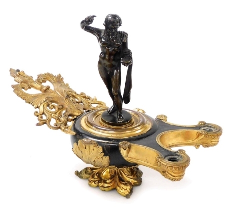 A 19thC French parcel gilt ormolu encrier, formed as a double burner Roman oil lamp, with highly ornate foliate scroll and acanthus leaf decoration, with a detachable bronze figure of Bacchus, measuring 15cm high, incorporating two protruding arms with re