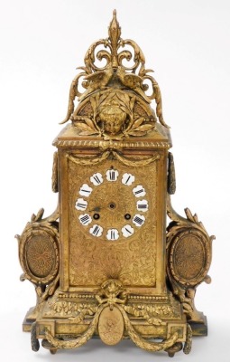 A late 19thC French gilt metal mantel clock, with black and white enamelled Roman numerals, the highly ornate case surmounted with love birds above a masked head, swag ornamentation and oval cameos, housing an eight day striking movement, 40cm high. - 2