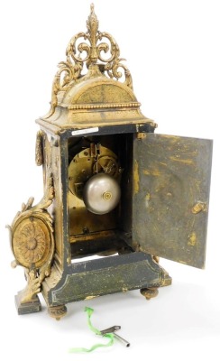 A late 19thC French gilt metal mantel clock, with black and white enamelled Roman numerals, the highly ornate case surmounted with love birds above a masked head, swag ornamentation and oval cameos, housing an eight day striking movement, 40cm high. - 3