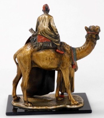 An Austrian rug seller and camel table strike lighter, manner of Franz Bergman, with patinated and cold painted finish depicting camel rider and rug seller, offering his wares, with striker, on black glass rectangular plinth, 18.5cm high. - 2