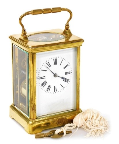 A brass cased carriage clock bearing Scouting crest, with white enamel dial and Roman numerals, the plain brass case with Scouting crest and motto 'Be Prepared' to the centre to case, the eight day movement with fast/slow regulator, and coil striking, 17.