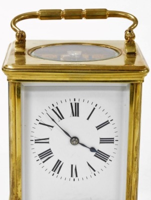 A brass cased carriage clock bearing Scouting crest, with white enamel dial and Roman numerals, the plain brass case with Scouting crest and motto 'Be Prepared' to the centre to case, the eight day movement with fast/slow regulator, and coil striking, 17. - 2