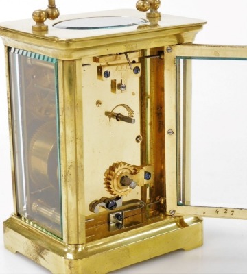 A brass cased carriage clock, with white enamel dial and Roman numerals, within a plain brass case, the movement with fast/slow regulator, 11.5cm high, with key. - 3