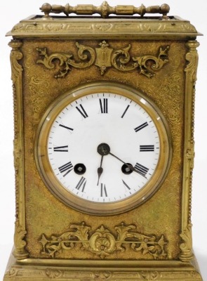 A late 19thC gilt cased mantel clock, with eight day striking movement, having white enamel dial and Roman numerals, the case with rococo scroll decoration and feet, 23cm high. (handle down) - 2