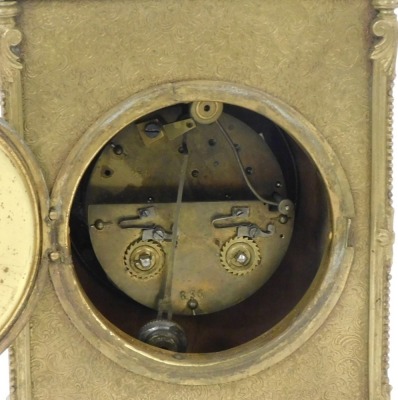 A late 19thC gilt cased mantel clock, with eight day striking movement, having white enamel dial and Roman numerals, the case with rococo scroll decoration and feet, 23cm high. (handle down) - 3