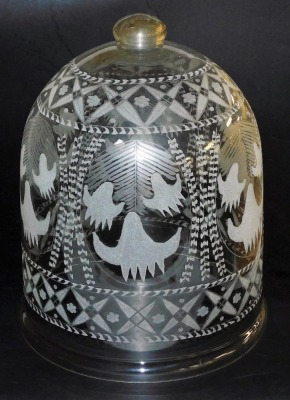 A 19thC Continental glass dome, with globular finial, engraved overall with stars and other motifs, 40cm high.