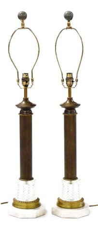 A pair of brass and moulded glass column lamp bases, with octagonal marble plinth and fitting, 82cm high overall. Buyer Note: WARNING! This lot contains untested or unsafe electrical items. It is supplied for scrap or reconditioning only. TRADE ONLY