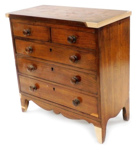 An early 19thC mahogany miniature chest of drawers, the rectangular top over two short and three long drawers, each with turned wood handles, on splayed feet, 36cm high, 35cm wide. (AF)