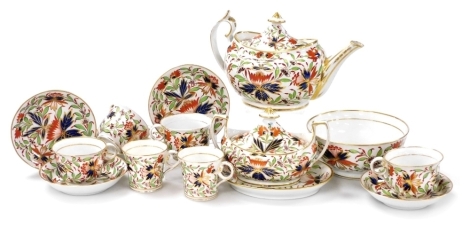 An early 19thC Chamberlain Worcester porcelain part tea and coffee service, decorated in Imari colours, with flowers, leaves, etc., within gilt borders, comprising teapot, sucrier, stand, slop bowl, coffee cans, teacups, etc.,