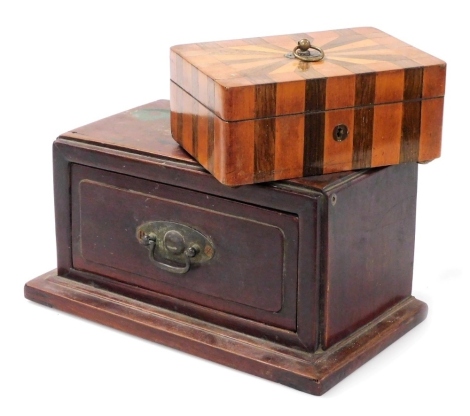 A fruitwood and rosewood parquetry inlaid musical box, the top decorated with a stylised sunburst and a brass ring handle, enclosing a velvet lined interior with musical movement, on shallow bun feet, 19cm wide, and a late 19th/early 20thC Oriental hardwo