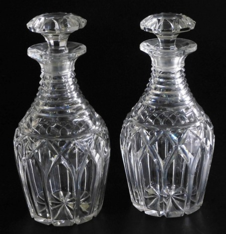 A pair of 19thC cut glass decanters, each with tapering ring neck and mushroom shaped stopper, 25cm high.