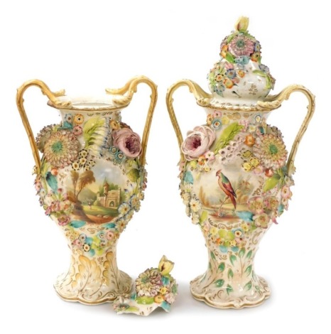 A near pair of 19thC Coalbrookdale porcelain two handled flower encrusted vases, each decorated with river landscapes with country houses, folly, etc., on a leaf decorated base, covers, possibly associated, 35.5cm and 35cm high respectively without covers