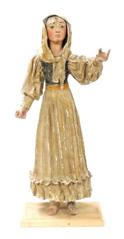 A Continental polychrome painted papier mache figure of a lady, modelled wearing a scarf and with a pleated skirt, on associated later base, 88cm high overall. (AF)