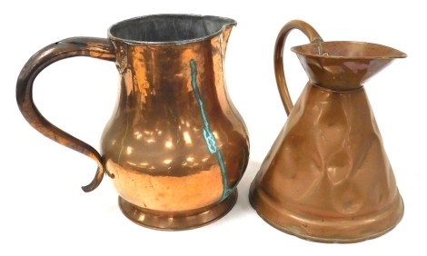 A 19thC copper two gallon flagon, 33cm high, and a smaller copper flagon, 31cm high. (AF)