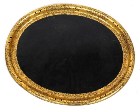 A Victorian ebonised papier mache oval tray, with elaborate gilt border, 79cm x 64cm.