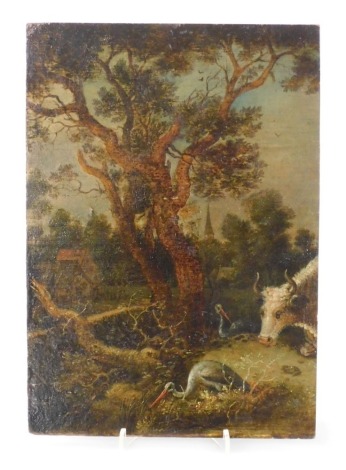 18thC Flemish School. Rural landscape with a cow and storks in the foreground, village and church in the distance, oil on oak panel, 26.5cm x 18.5cm.