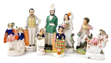 Eight Victorian Staffordshire figures, in coloured enamels, one entitled Moody, another of a standing gentleman with plumed hat, a boy seated on a goat, highland girl, etc., heights varying from 15cm to 27.5cm.