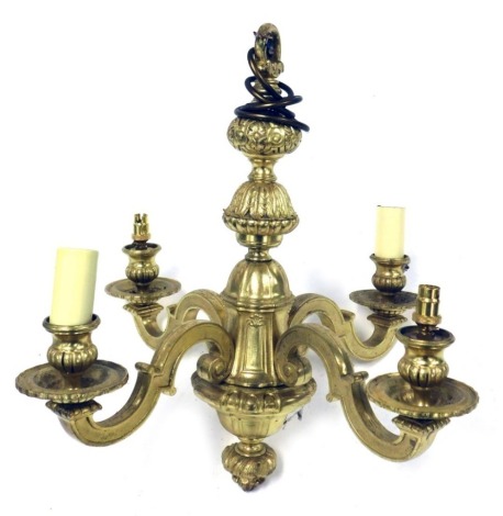 A heavy gilt four branch pendant light fitting, with stylised scroll branches and urn shaped sconces, 46cm high.