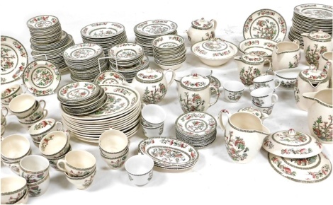 An extensive service of Johnson Bros Indian Tree pattern dinner and tea wares, including dinner plates, soup plates, lidded jugs, oval serving dishes, cups, saucers, tea plates, etc., approx 230 pieces.