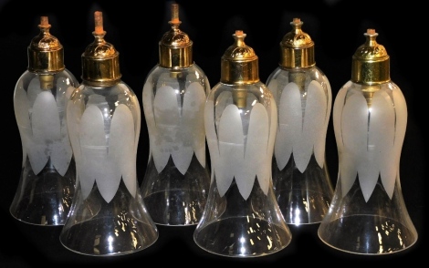 A set of six glass light shades, of flared slightly bulbous form, with acid etched decoration and gilt electric fittings, 20cm high.