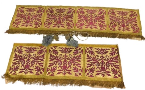 Two 19thC needlework embroidery frontal panels, with gilt braid design on a rouge background, and tassel braided pendant borders, hessian backed, one frontal with three panels, the other matching frontal with four panels, 50cm x 160cm and 50cm x 210cm, an