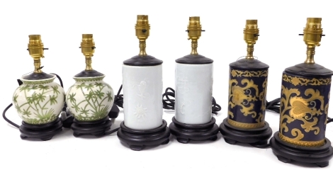 Three pairs of Chinese ceramic table lamps, in varying styles.