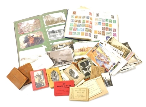 A The Post Boy stamp album and a collection of world stamps, predominantly 1920s and 30s world stamps, and some loose stamps, and a postcard album containing a collection of various cards including topographical subjects, military interest include Anzac c