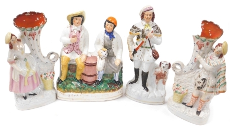 Four Victorian Staffordshire flat back figures, including a figure group of Tam O' Shanter and Souter Johnnie, 33cm high, another of a huntsman with spaniel, 35cm high, and a pair of figures holding cornucopia spill vases, 33cm and 34cm.