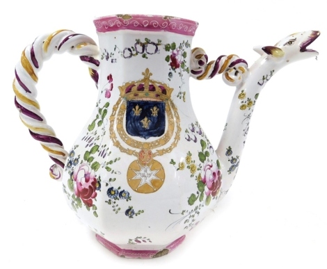 A late 18thC faience coffee pot, lid lacking, with a serpent formed spout and spiral twist handle, of octagonal baluster form, painted with the Royal Coat of Arms France, and floral sprays, painted mark H/39, 23cm high.