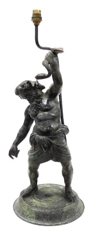 A late 19thC Continental bronze figural table lamp, modelled as Silenus, standing holding a serpent, raised on a circular base, 65cm high. (AF)