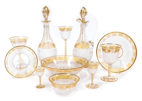 A late 19thC French part suite of cut and gilt decorated table glassware, possibly St Louis, comprising a decanter and stopper, claret jug and stopper, three wine glasses, two smaller glasses, finger bowl and saucer, plate and a bowl. (11)