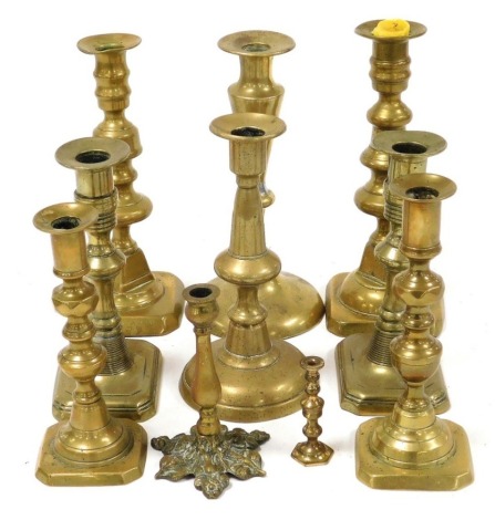 A group of 19thC brass candlesticks, pairs and singles. (a quantity)