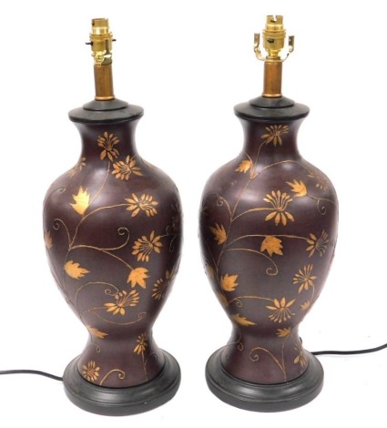 A pair of Chinese brown glazed table lamps, of baluster form, gilt decorated with flowers, 58cm high.