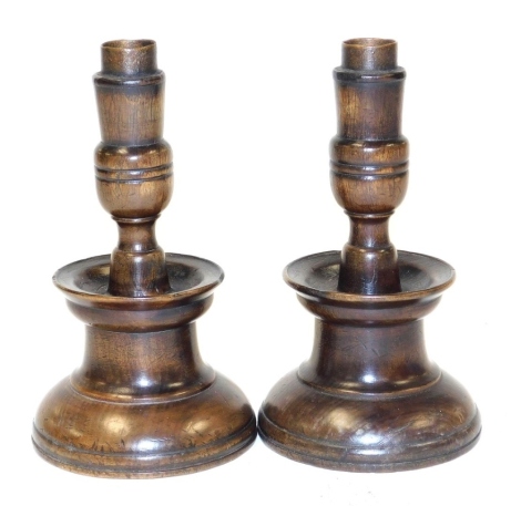 A pair of 18thC fruitwood candlesticks, 17.5cm high.