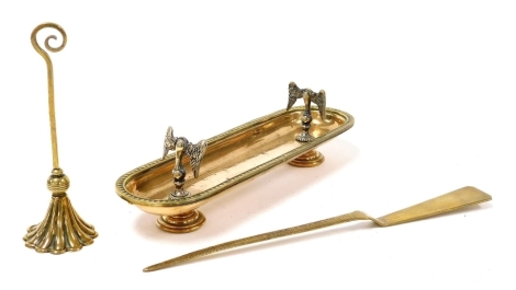 A Victorian brass and copper pen stand, of oval form, 22cm wide, together with a brass letter opener by PHV and Company, and a brass candle snuffer. (3)