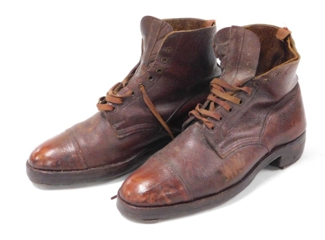 A pair of early 20thC vintage leather mountain climbing boots, 31cm wide.