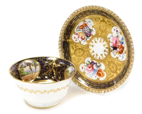 An early 19thC Ridgways porcelain dish, painted with reserves of flowers against a yellow and gilt floral ground, within blue and gilt borders, together with an early 19thC porcelain slop bowl, painted with landscape reserves, against a cobalt blue and gi